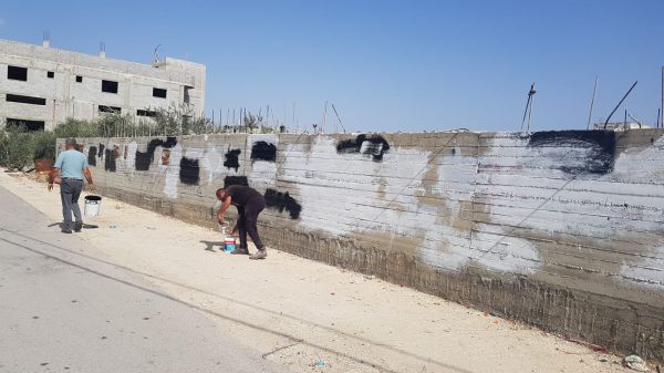 זו הרתעה: תושבי חווארה מחקו את צלבי הקרס