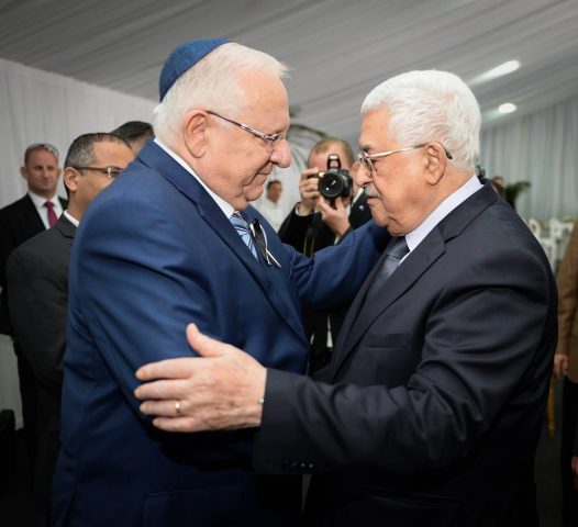 President Reuven Rivlin meets Palestinian Authority President Mahmoud Abbas during the State funeral for late former President Shimo Peres at Mount Herzl Cemetery in Jerusalem, on September 30, 2016. Peres was hospitalized in the Sheba Medical Centre on Tuesday, September 13, 2016, after suffering a stroke, and passed away last night at the age of 93. Photo by Mark Neyman/GPO *** Local Caption *** ùîòåï ôøñ ðôèø äø äøöì ìååéä äìååéä îîìëúéú