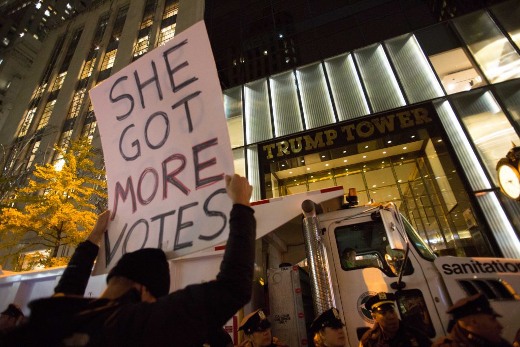 People take part at a protest against elected president Donald Trump, outside the Trump Tower in Manhattan, New York, November 9, 2016. Photo by Noam Revkin Fenton/Flash90 *** Local Caption *** הפגנה מנהטן טראמפ בחירות ארהב ארצות הברית צעדה צועדים מפגינים