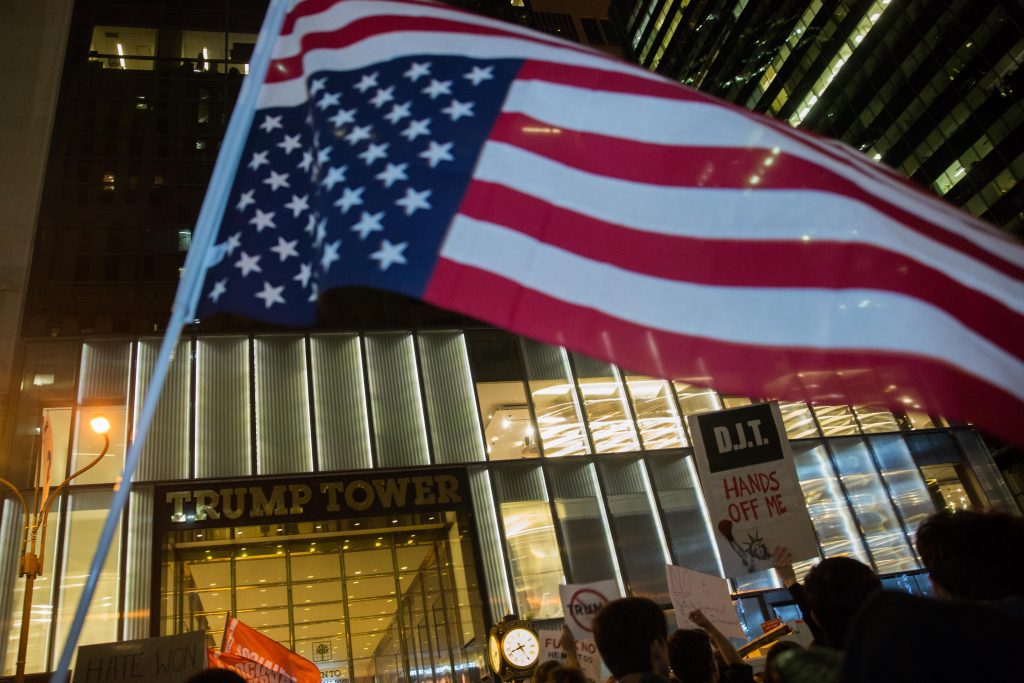 People take part at a protest against elected president Donald Trump, outside the Trump Tower in Manhattan, New York, November 9, 2016. Photo by Noam Revkin Fenton/Flash90 *** Local Caption *** הפגנה מנהטן טראמפ בחירות ארהב ארצות הברית צעדה צועדים מפגינים